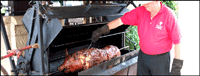 Pig roasting on spit